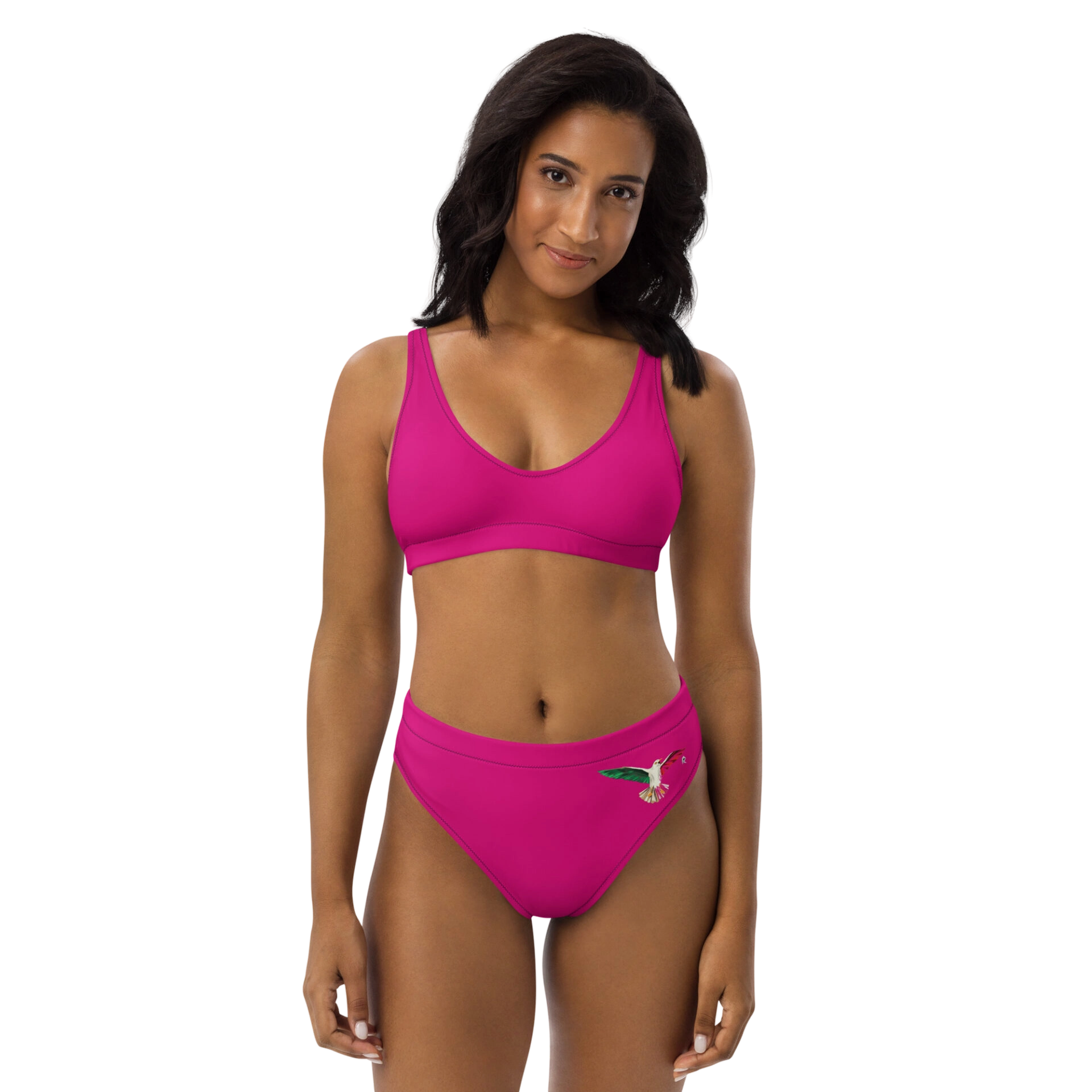 Woman wearing pink bikini set on black background