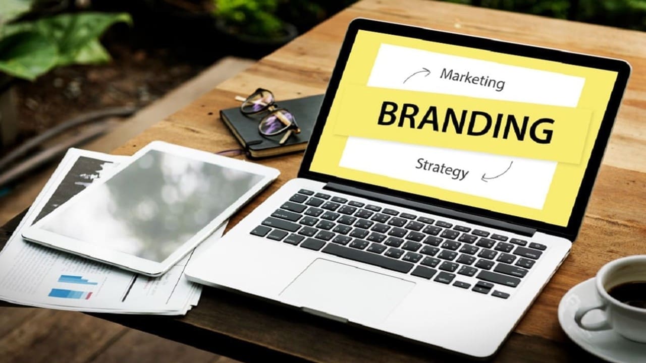Laptop displaying branding strategy on desk